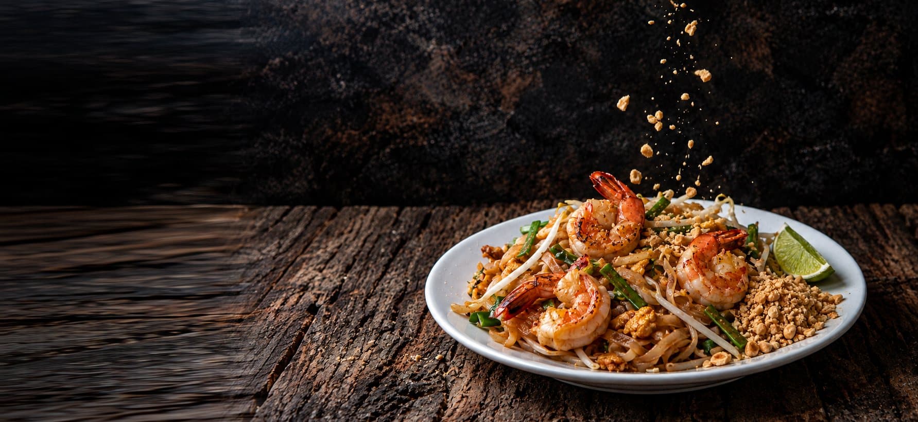 Shrimp Pad Thai with crushed peanuts, bean sprouts and lime